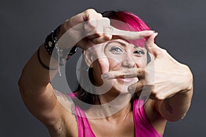 Happy woman framing face photo