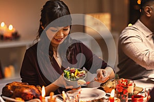 happy woman with friends having christmas dinner