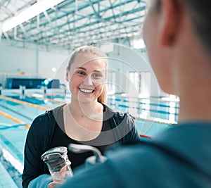 Happy woman, friends and talking in swimming fitness, exercise or training together in sport at indoor pool. Female