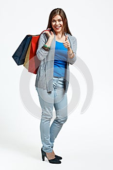 Happy woman full body portrait with shopping bag