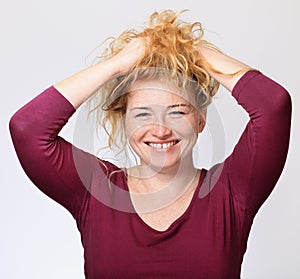 Happy woman fun and joy with her curly hair