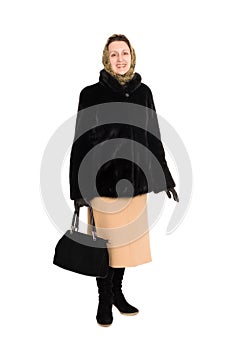 Happy woman in fur coat of mink.