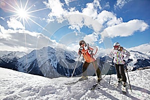 Happy woman and girl on mountains ski resort