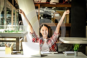 Happy woman girl teenager raising hands with gladness happiness