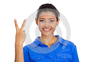 Happy woman giving peace victory or two sign gesture