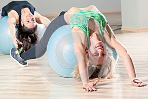 A happy woman in a group doing pilates