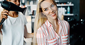 Happy woman at the hair salon