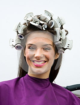Happy woman in hair salon