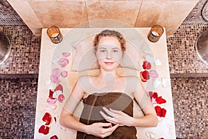 Happy woman in hammam or turkish bath in relax