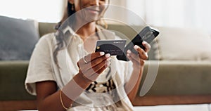 Happy woman, hands and phone with credit card for payment, online shopping or transaction in living room at home