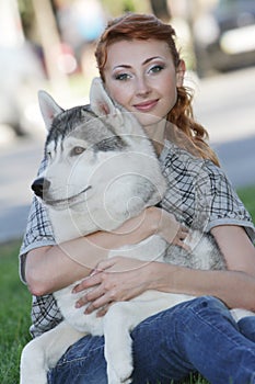 Happy woman and haski dog outdoors