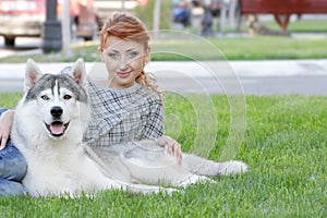 Happy woman and haski dog outdoors