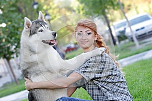 Happy woman and haski dog outdoors