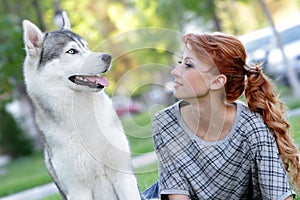 Happy woman and haski dog outdoors