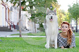 Happy woman and haski dog outdoors