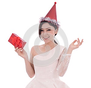 happy woman with hat and holding a red christmas gift box isolated on a white background