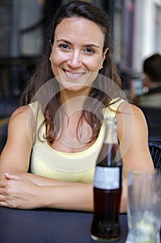 happy woman having coke in restaurant
