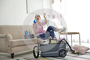 Happy woman having fun while cleaning