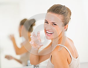 Happy woman having fun time while washing hands