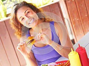 Happy Woman Having Mini Hamburger