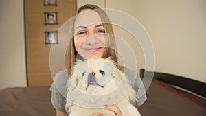 Happy woman having a video chat with friend.