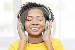 Happy woman with headphones listening to music