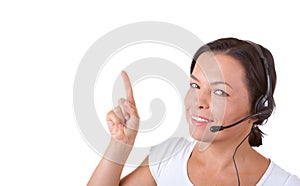 Happy Woman with Headset Working at Callcenter Shows Finger Dire
