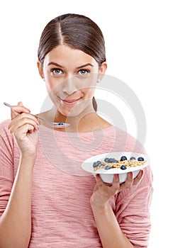Happy, woman and healthy breakfast bowl of cereal for eating against white studio background. Portrait of isolated young