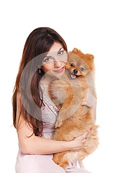 Happy woman and her beautiful little red dog spitz over white background close portrait