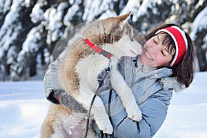 Happy woman and her Husky puppy