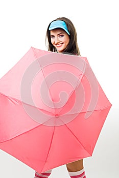 Happy woman hide behind pink umbrella