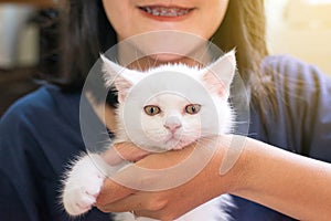 Happy woman holding cat Scottish white fluffy cute little animal