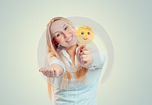 Happy woman holding giving stick with emoji