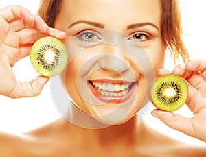 Happy woman holding kiwi