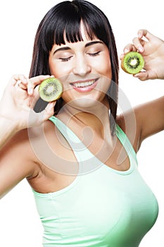 Happy woman holding kiwi