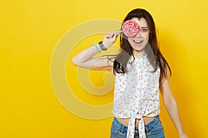 Happy woman holding a lollipop.