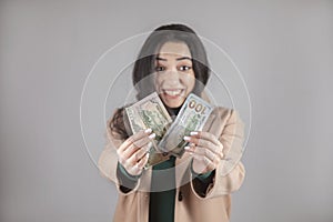 happy woman holding money