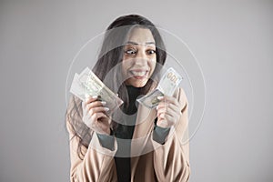 Happy woman holding money