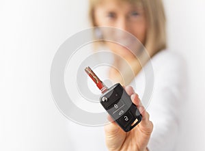 Happy woman holding new car keys