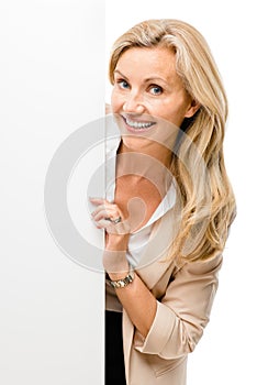 Happy woman holding placard smiling isolated on white background