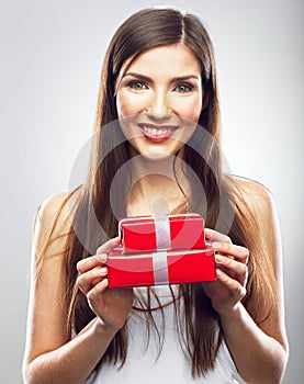 Happy woman holding red gift box.