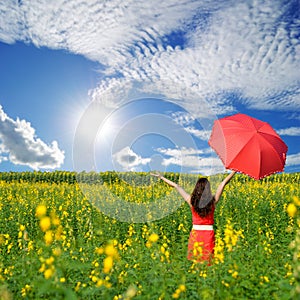 Happy woman holding red umbrella and bule sky