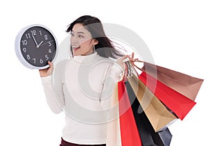 Happy woman holding shopping bag and clock isolate on white back