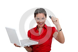 Happy woman holding USB key