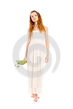 Happy woman holding white tulips