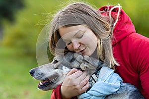 Happy woman hugging dog. pet adoption.  czechoslovak with female owner.