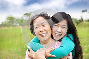 Happy woman hugging with her mother