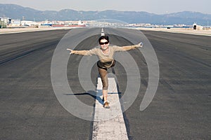 Happy woman imitating airplane