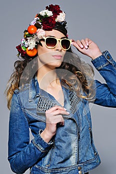 Happy woman in jeans outfit and sunglasses