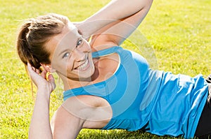 Happy woman jogger training in the park